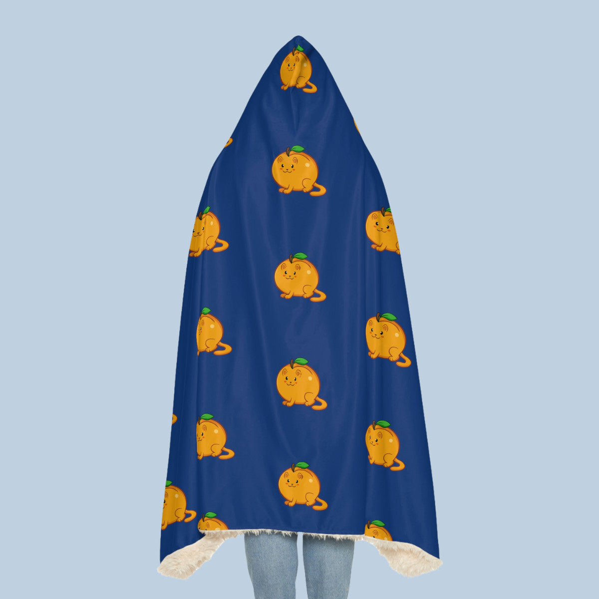 Happy woman wearing the dark blue Apricat⢠hooded sherpa blanket seen from behind. Apricat⢠is an apricot drawn as a cute cat.