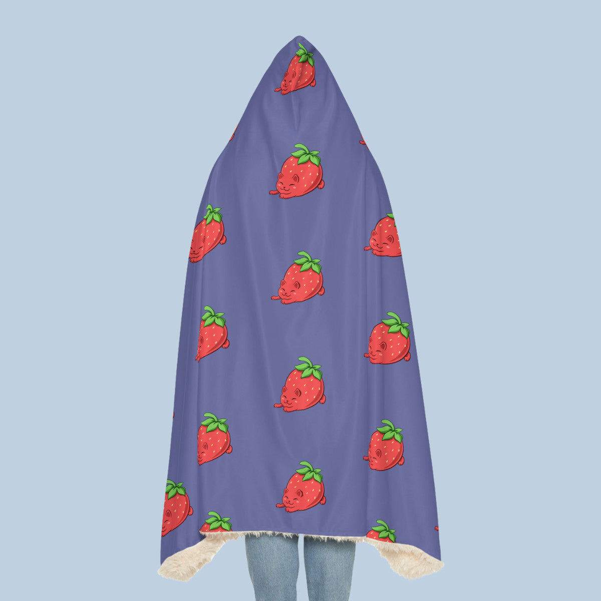 Happy woman wearing the purple Clawberry⢠hooded sherpa blanket seen from behind. Clawberry⢠is a strawberry drawn as a cute cat.