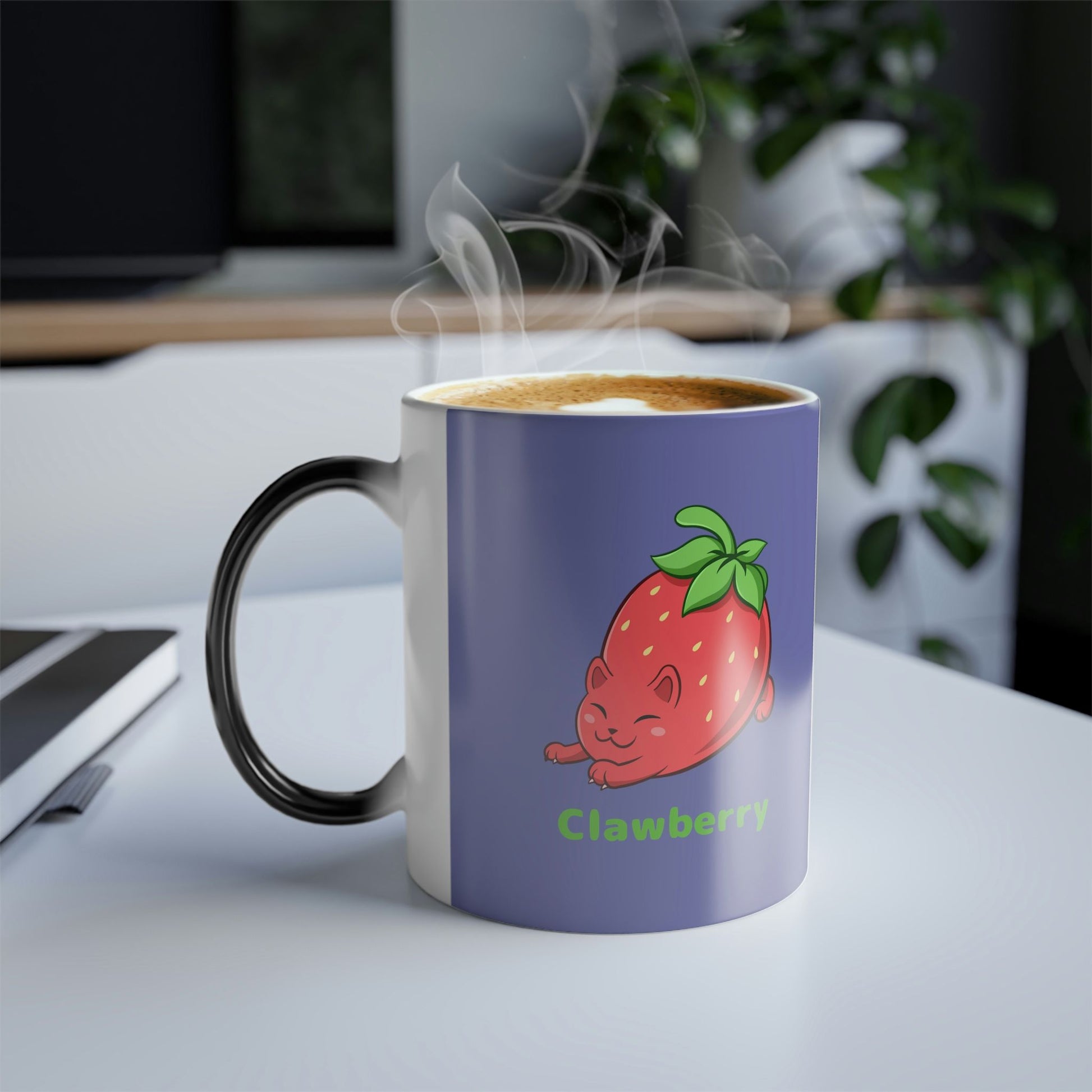 Purple Magic Mug with Clawberry⢠print standing on an office desk. Clawberry⢠is a strawberry drawn as a cute cat.