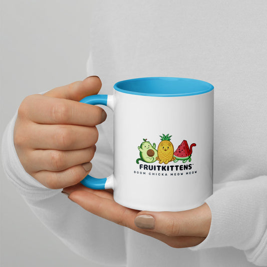 Hands holding a white and blue Coffee Mug with with Fruitkittens⢠logo. Fruitkittens⢠are fruits drawn as cute cats. The logo features Pawocadoâ˘, Pawnapple⢠and Watermewlonâ˘