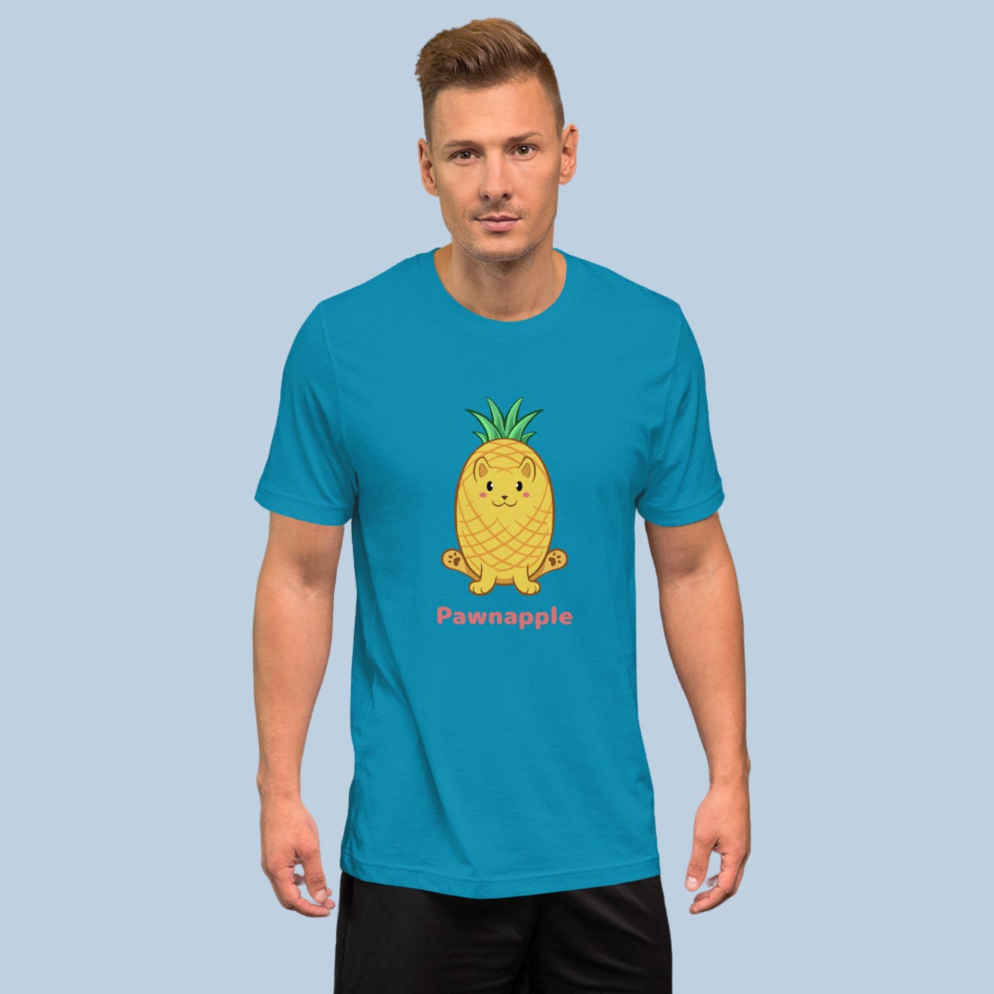 Man wearing an aqua blue T-Shirt with Pawnapple⢠print. Pawnapple⢠is a pineapple drawn as a cute cat.