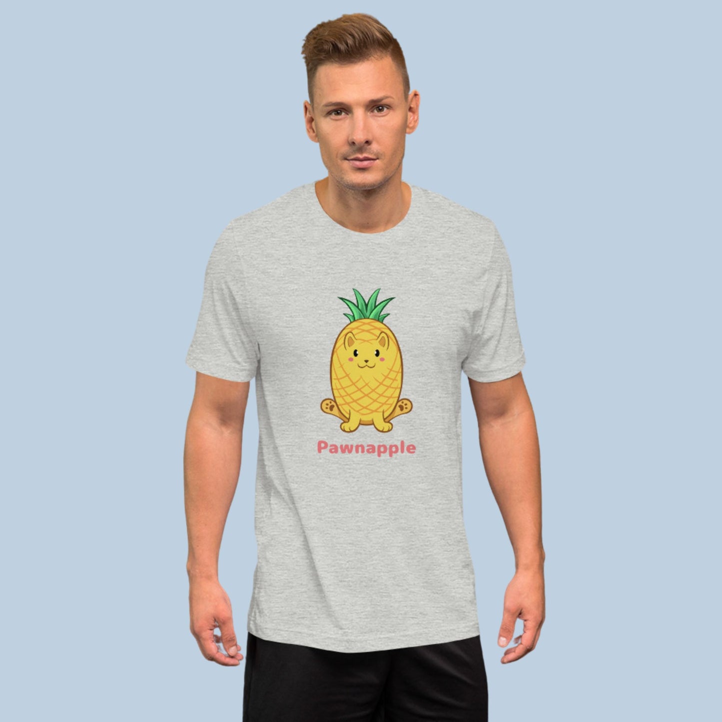 Man wearing an athletic heather grey T-Shirt with Pawnapple⢠print. Pawnapple⢠is a pineapple drawn as a cute cat.
