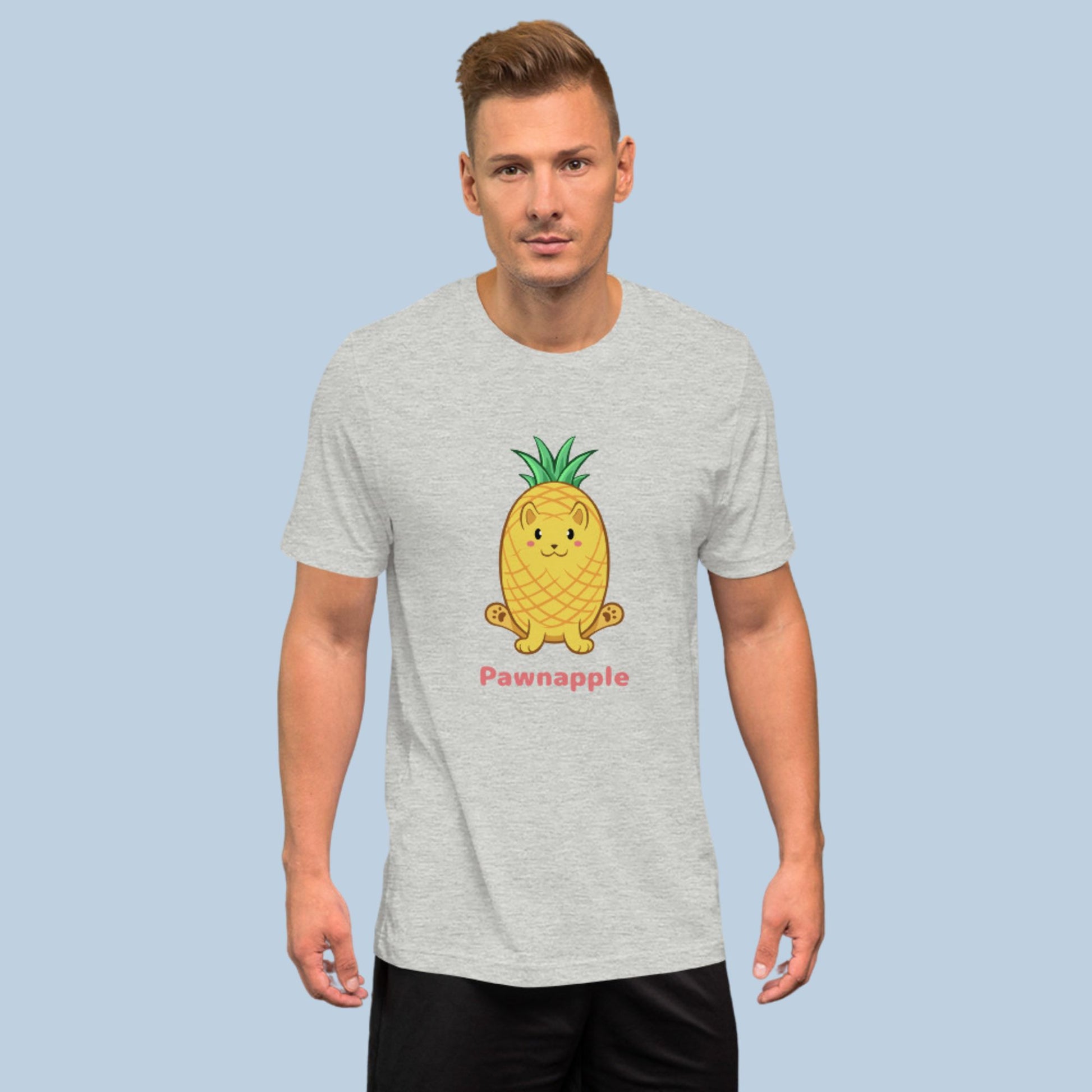 Man wearing an athletic heather grey T-Shirt with Pawnapple⢠print. Pawnapple⢠is a pineapple drawn as a cute cat.