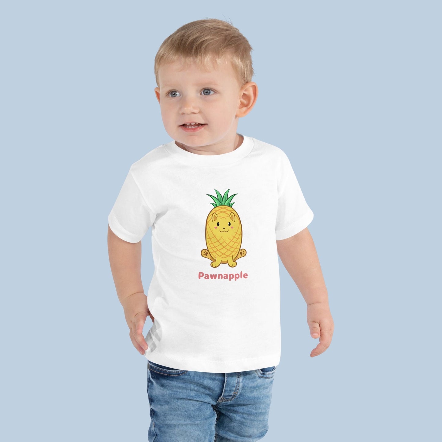 Toddler wearing a white Toddler T-Shirt with Pawnapple⢠print. Pawnapple⢠is a pineapple drawn as a cute cat.