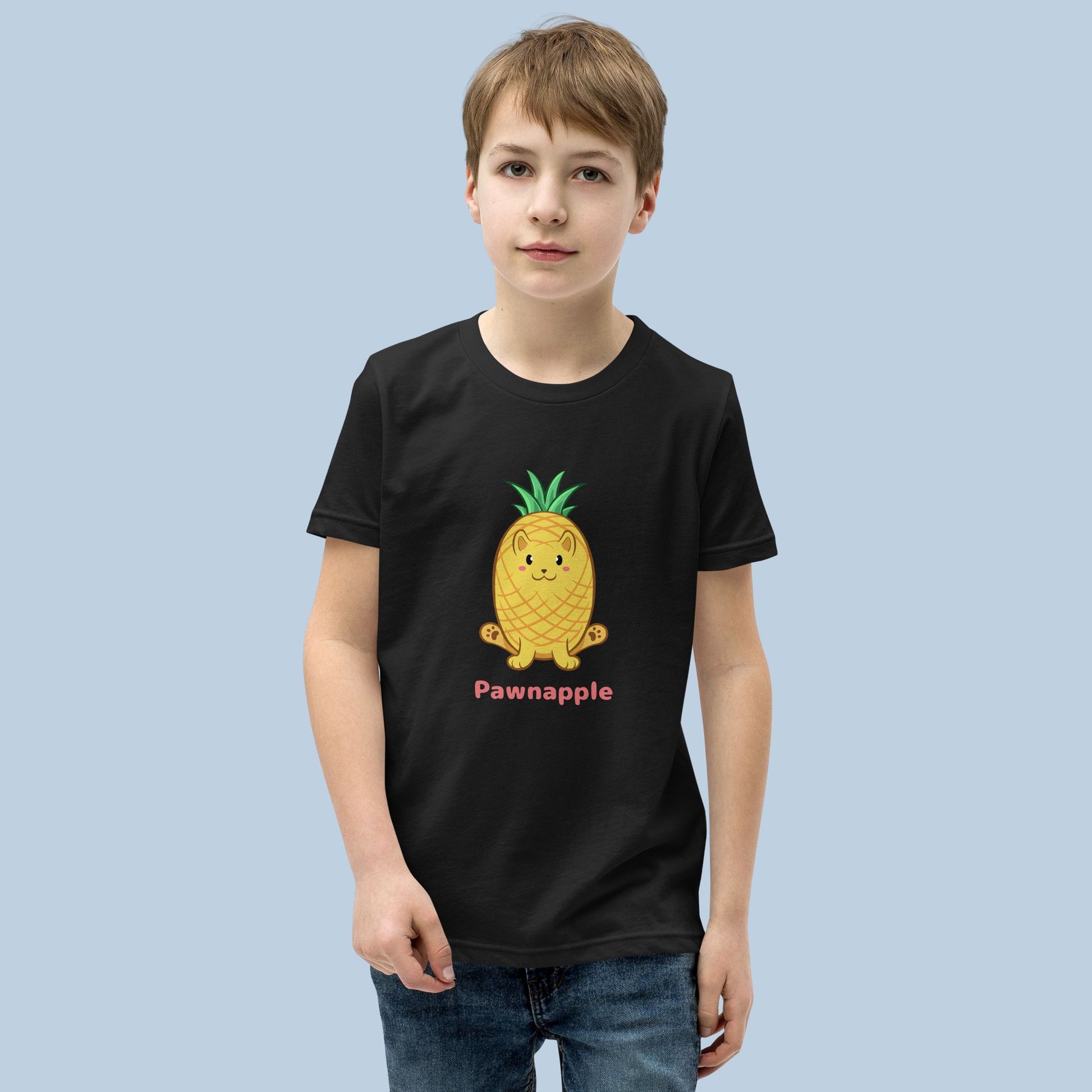 Boy wearing a black T-Shirt with Pawnapple⢠print. Pawnapple⢠is a pineapple drawn as a cute cat.
