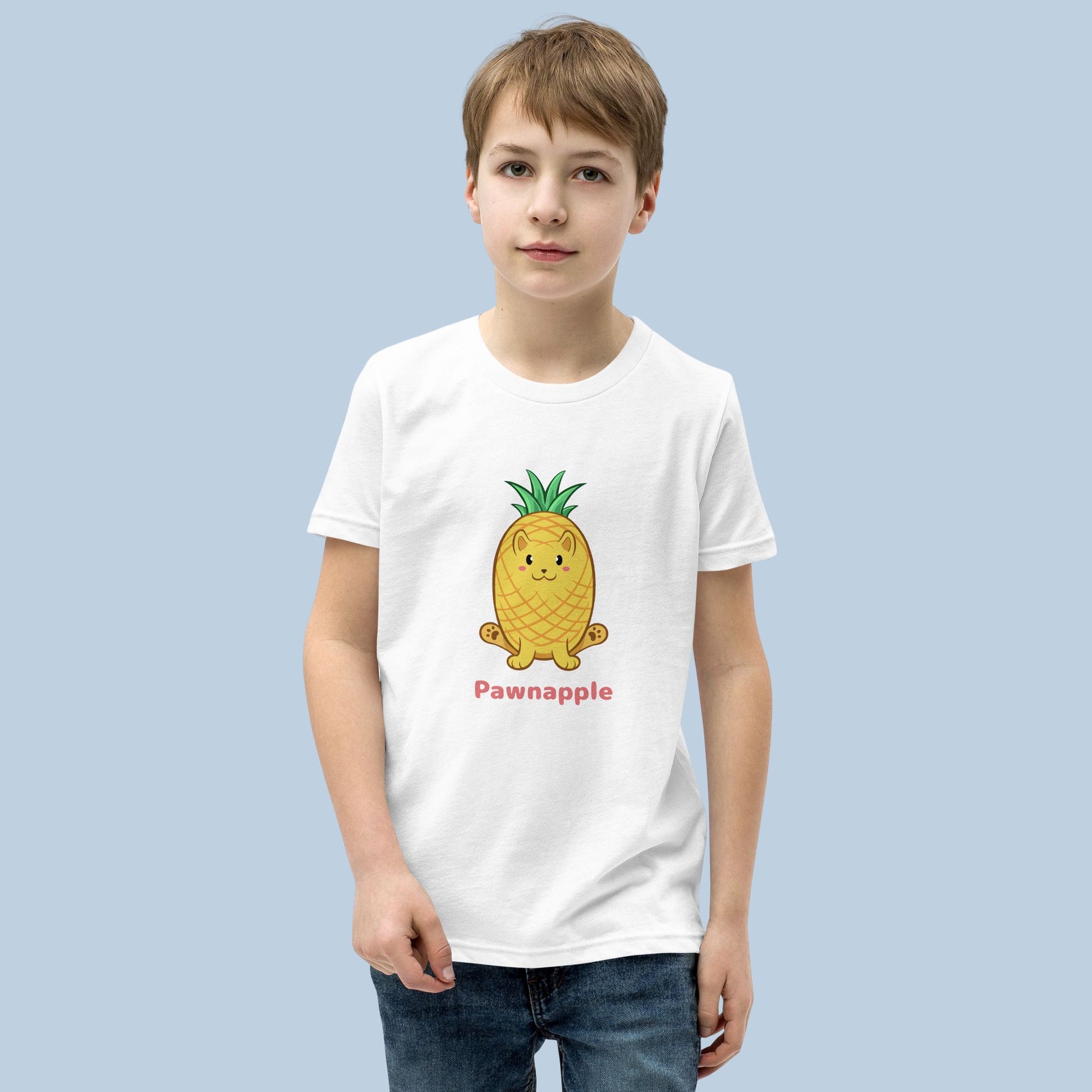 Boy wearing a white T-Shirt with Pawnapple⢠print. Pawnapple⢠is a pineapple drawn as a cute cat.