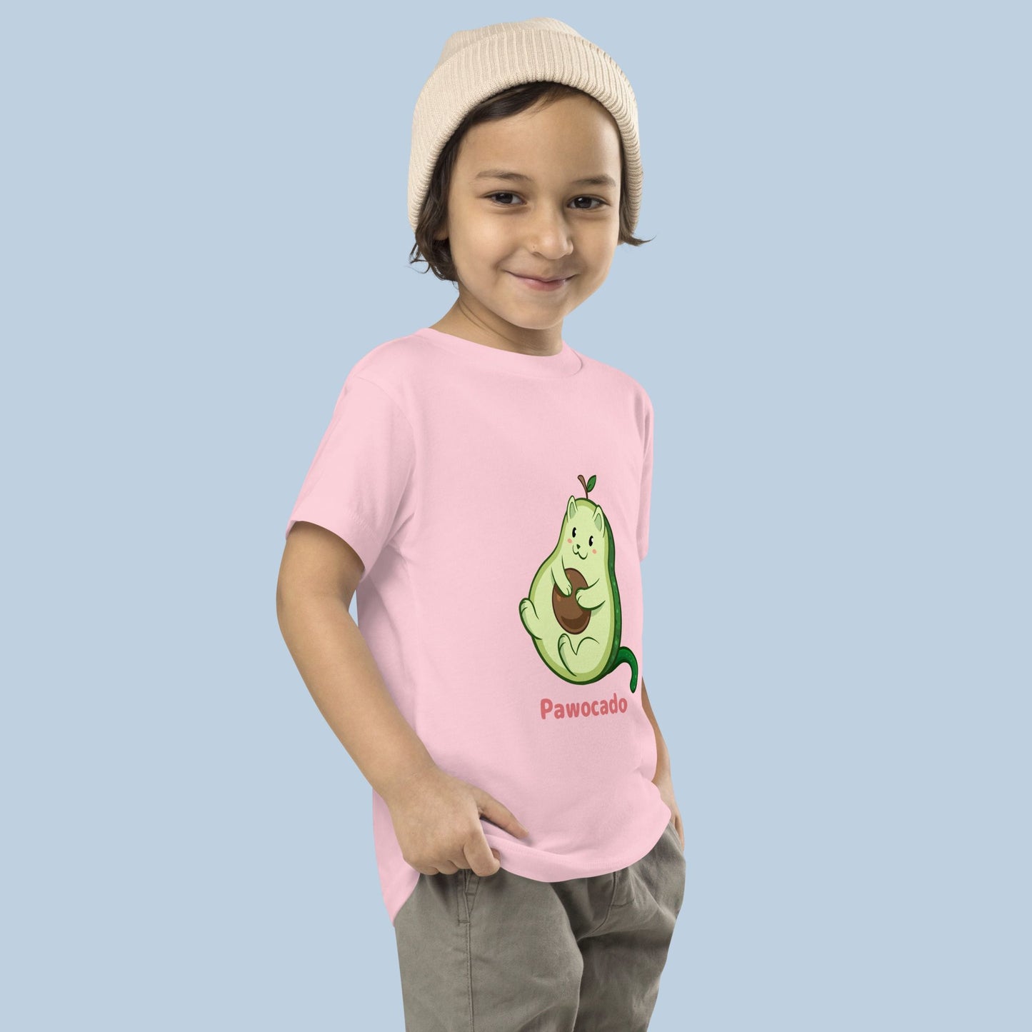Toddler wearing a pink Toddler T-Shirt with Pawocado⢠print. Pawocado⢠is an avocado drawn as a cute cat.