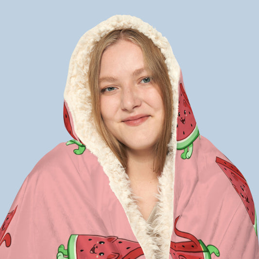 Happy woman wearing the pink Watermewlon⢠hooded sherpa blanket face zoomed in. Watermewlon⢠is a watermelon drawn as a cute cat.