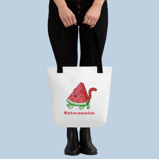 Person holding a white Tote Bag with Watermewlon⢠print. Watermewlon⢠is a watermelon drawn as a cute cat.