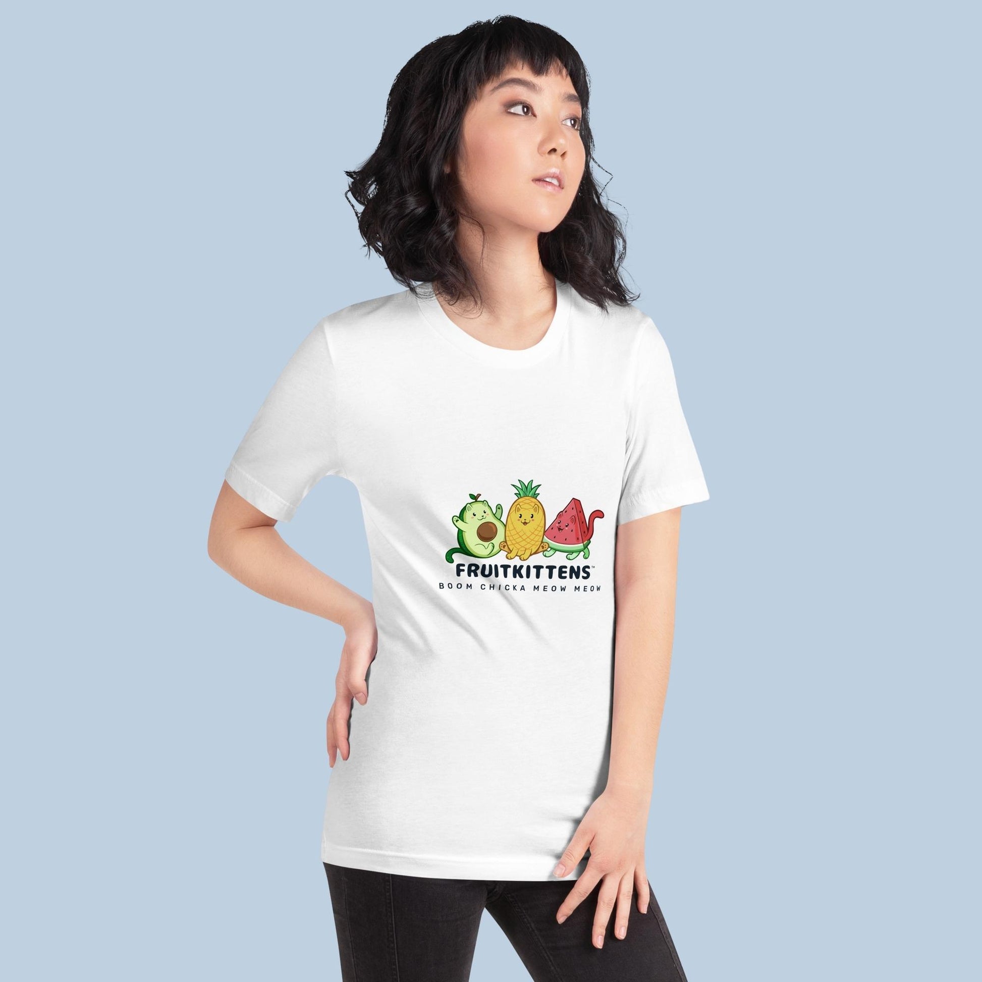 Woman wearing a white T-Shirt with Fruitkittens⢠logo. Fruitkittens⢠are fruits drawn as cute cats. The logo features Pawocadoâ˘, Pawnapple⢠and Watermewlonâ˘.