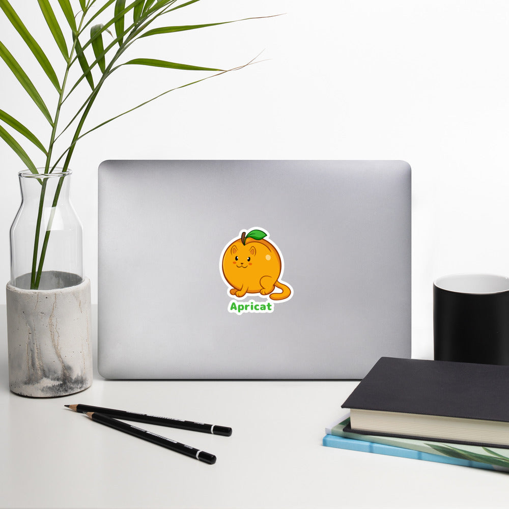 5.5 x 5.5 inch Sticker with Apricat™ print. The sticker is on a laptop. Apricat™ is an apricot drawn as a cute cat.