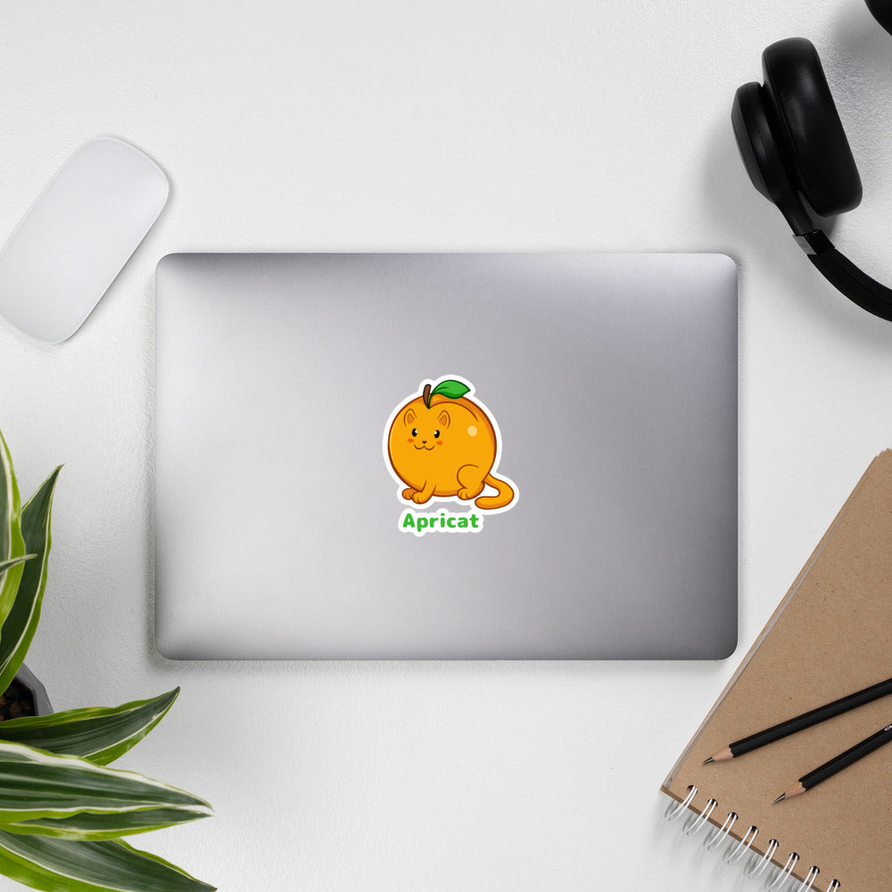 5.5 x 5.5 inch Sticker with Apricat™ print. The sticker is on a laptop. Apricat™ is an apricot drawn as a cute cat.