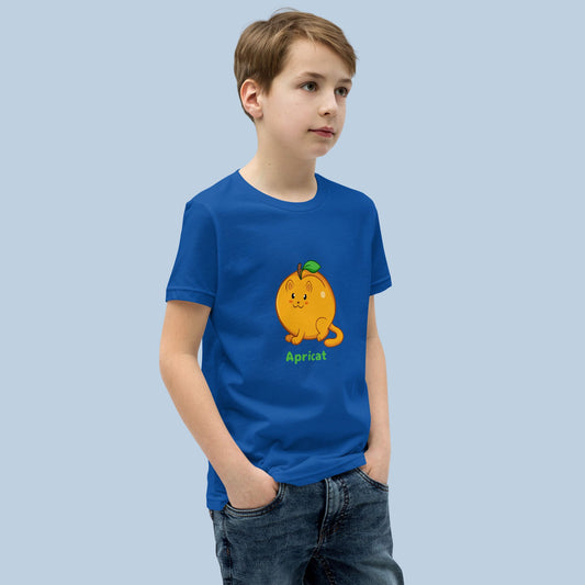 Boy wearing a royal blue T-Shirt with Apricat™ print. Apricat™ is an apricot drawn as a cute cat.