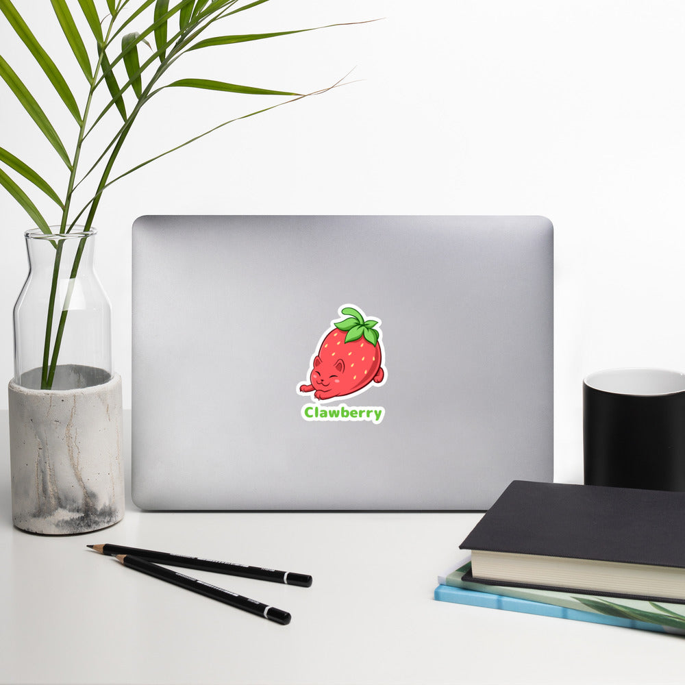 5.5 x 5.5 inch Sticker with Clawberry™ print. The sticker is on a laptop. Clawberry™ is a strawberry drawn as a cute cat.