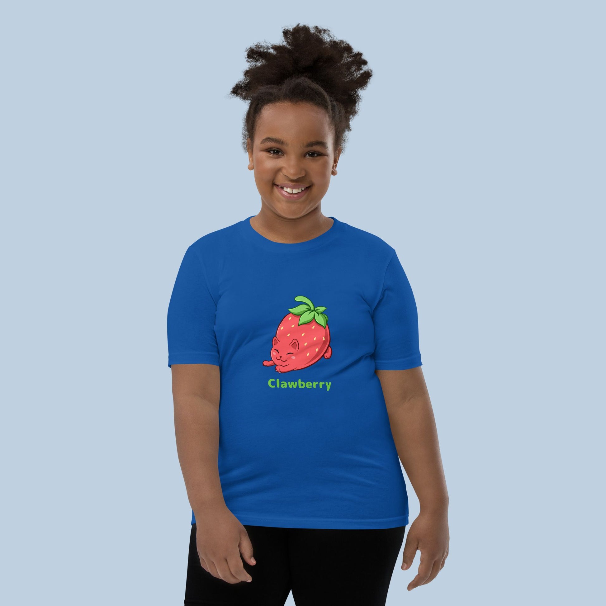 Girl wearing a royal blue T-Shirt with Clawberry™ print. Clawberry™ is a strawberry drawn as a cute cat.