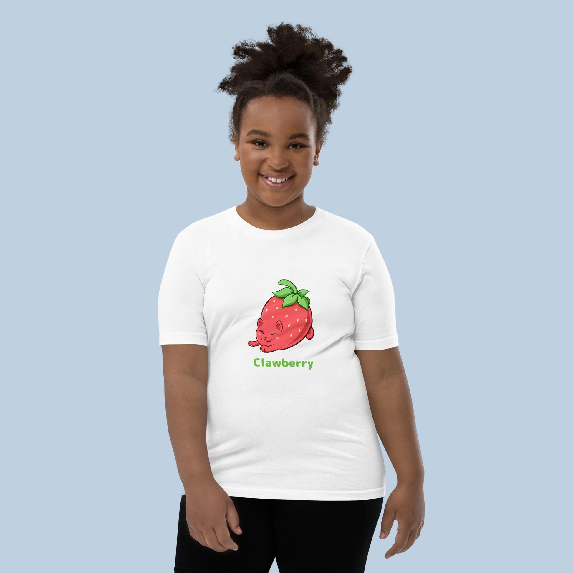 Girl wearing a white T-Shirt with Clawberry™ print. Clawberry™ is a strawberry drawn as a cute cat.