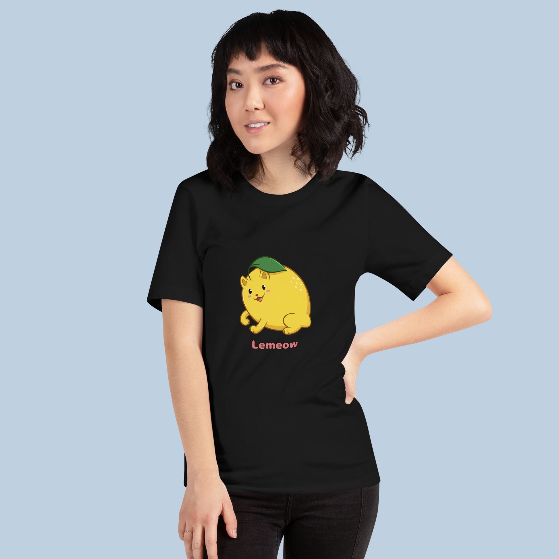 Woman wearing a black T-Shirt with Lemeow™ print. Lemeow™ is a lemon drawn as a cute cat.