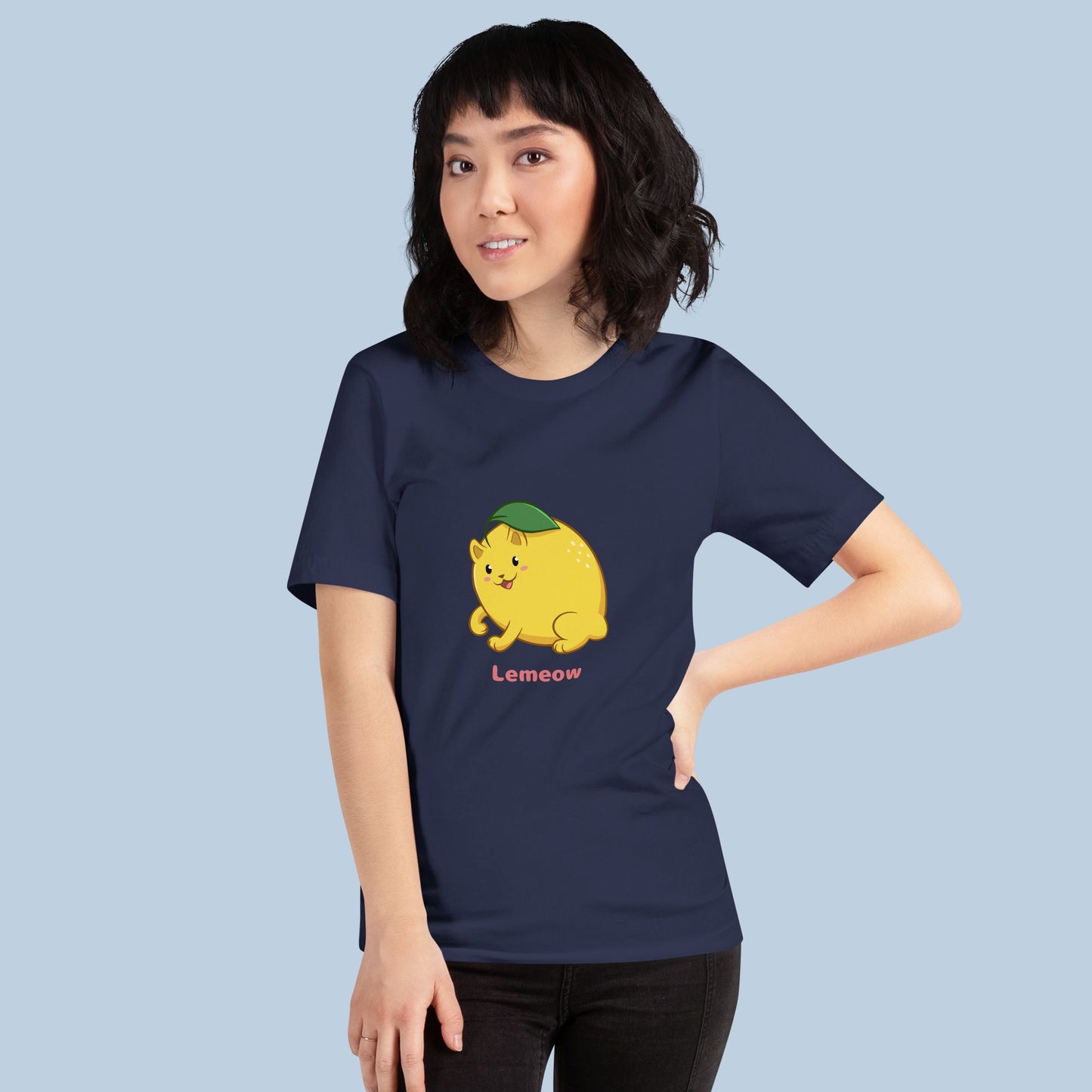 Woman wearing a navy blue T-Shirt with Lemeow™ print. Lemeow™ is a lemon drawn as a cute cat.