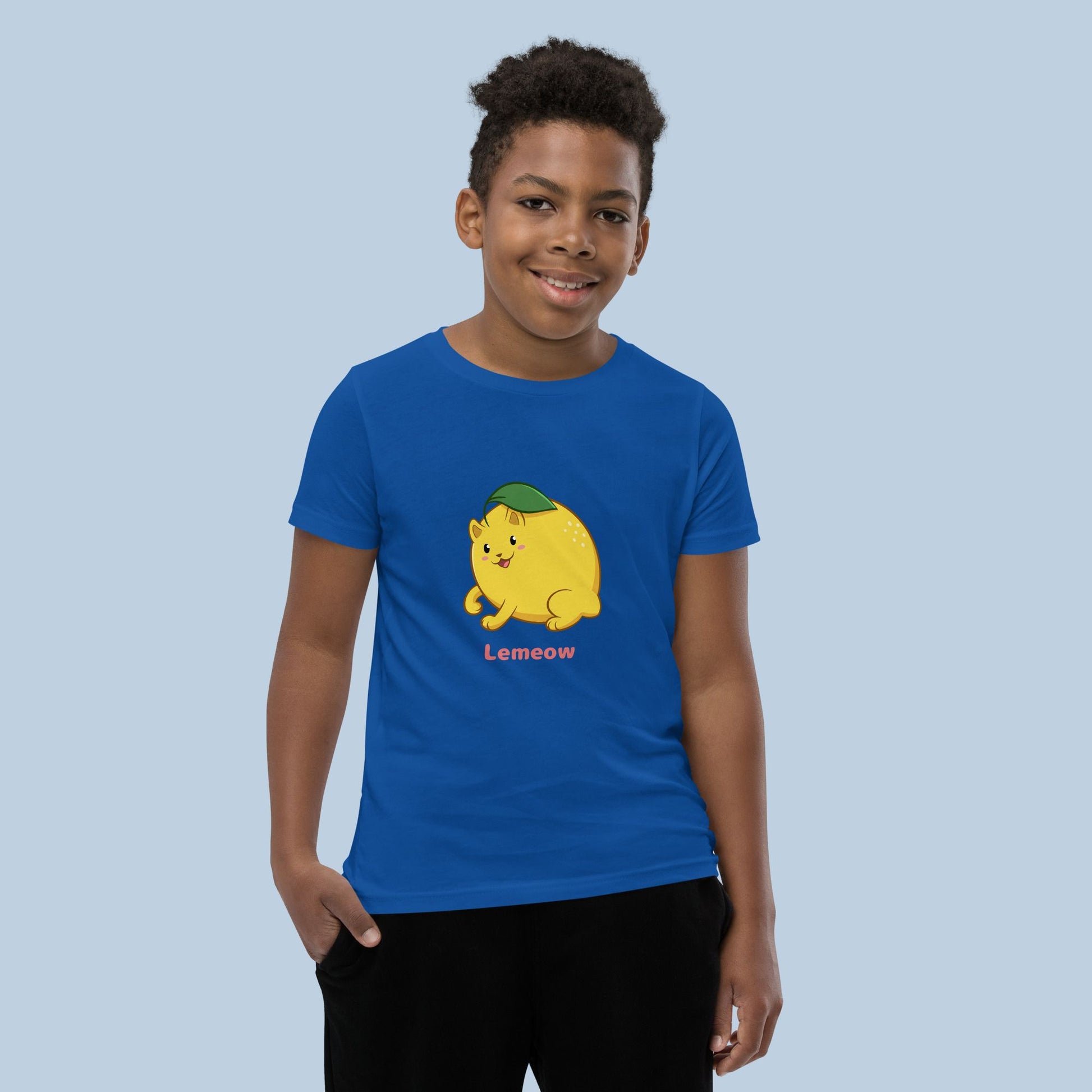 Boy wearing a royal blue T-Shirt with Lemeow™ print. Lemeow™ is a lemon drawn as a cute cat.