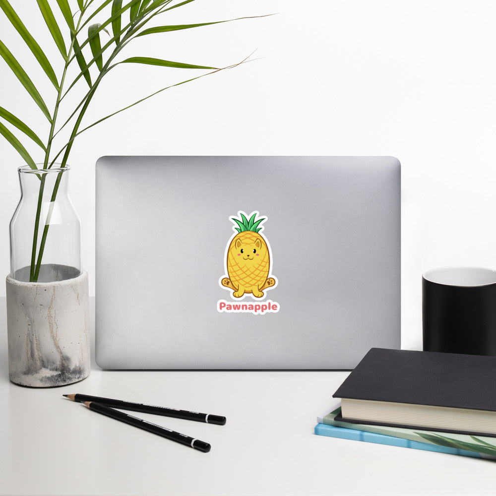 5.5 x 5.5 inch Sticker with Pawnapple™ print. The sticker is on a laptop. Pawnapple™ is a pineapple drawn as a cute cat.