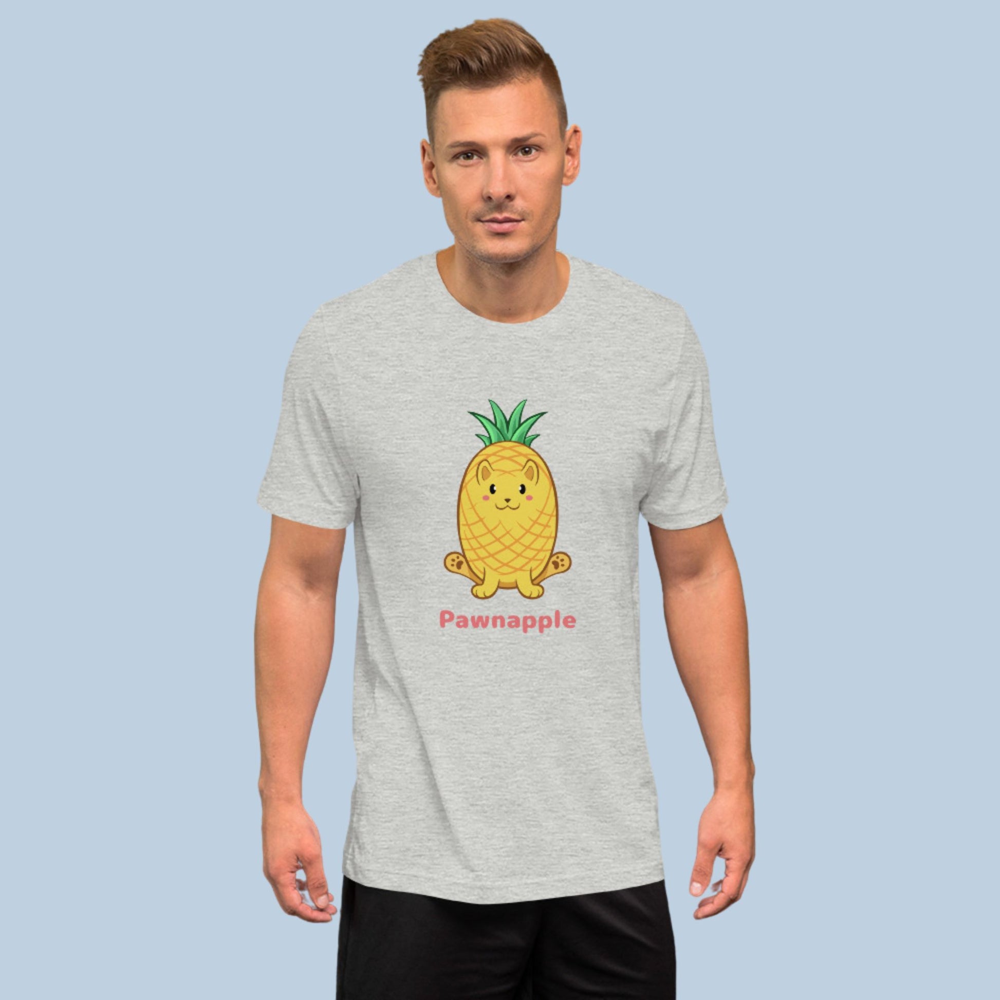 Man wearing an athletic heather grey T-Shirt with Pawnapple™ print. Pawnapple™ is a pineapple drawn as a cute cat.