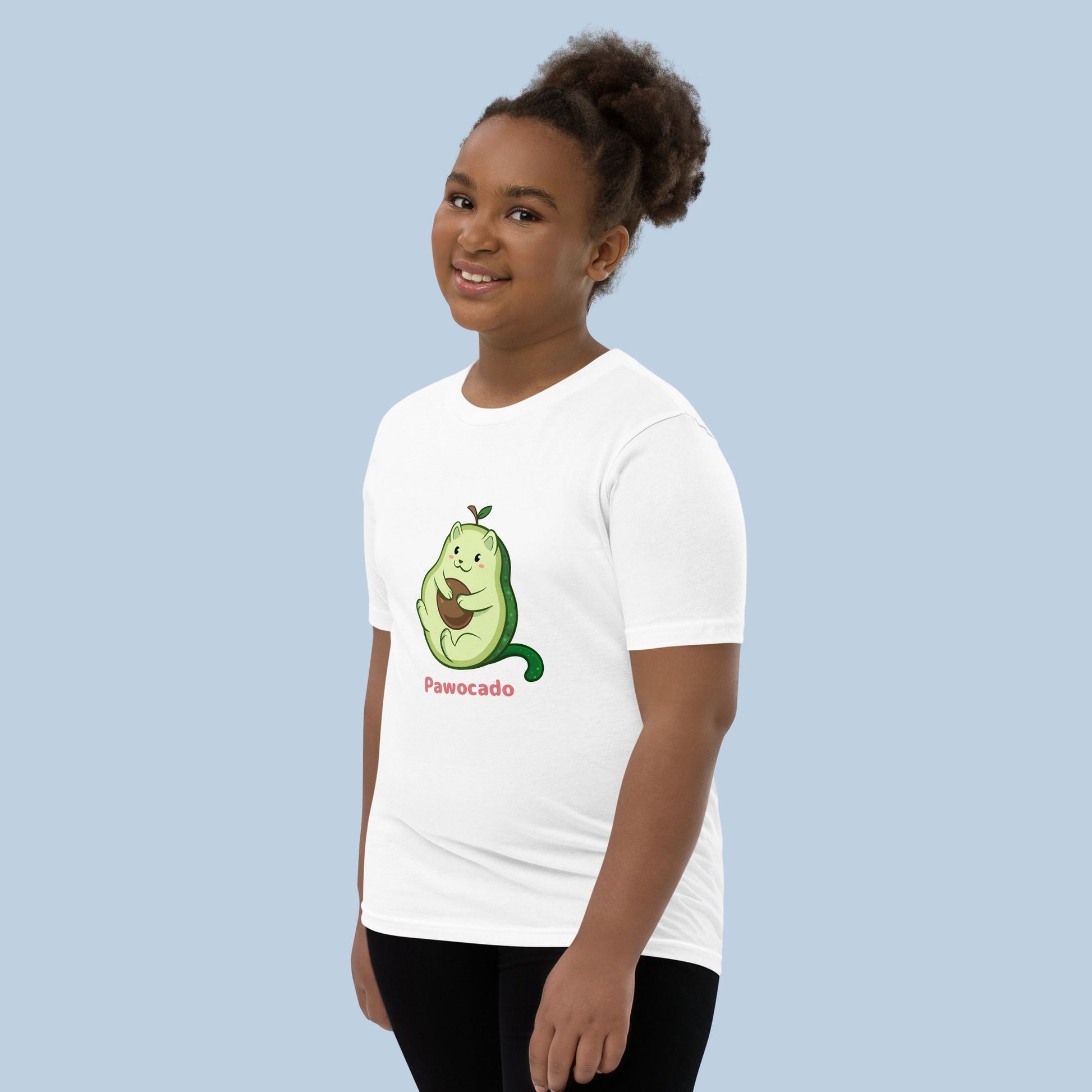 Girl wearing a white T-Shirt with Pawocado™ print. Pawocado™ is an avocado drawn as a cute cat.